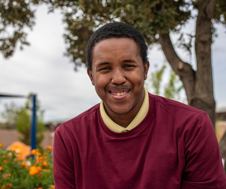 Image of a man smiling outdoors